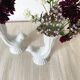 Pair of porcelain candle holders and bird vases