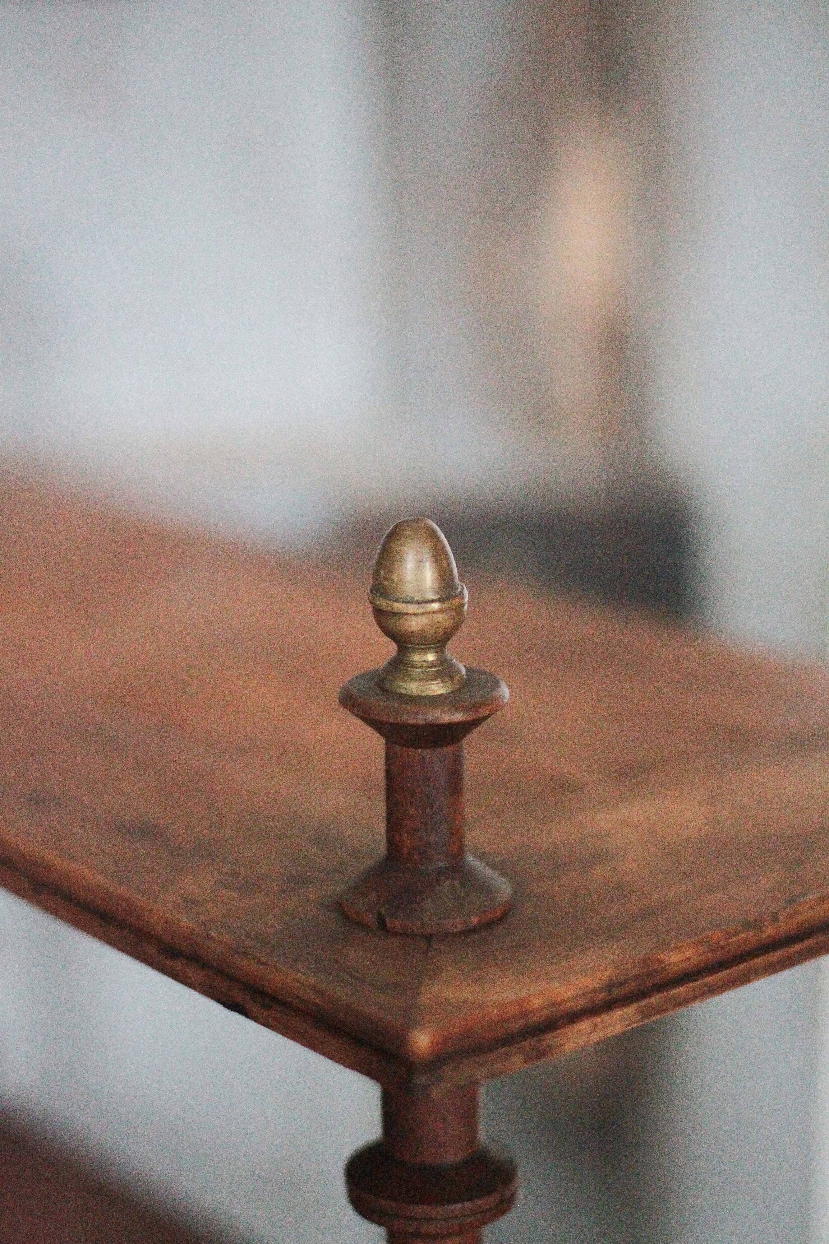 Napoleon III spool shelf, floor-standing shelf with brass tips.