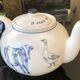 White porcelain teapot decorated with animals