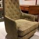 Mid-century buttoned armchair with metal legs