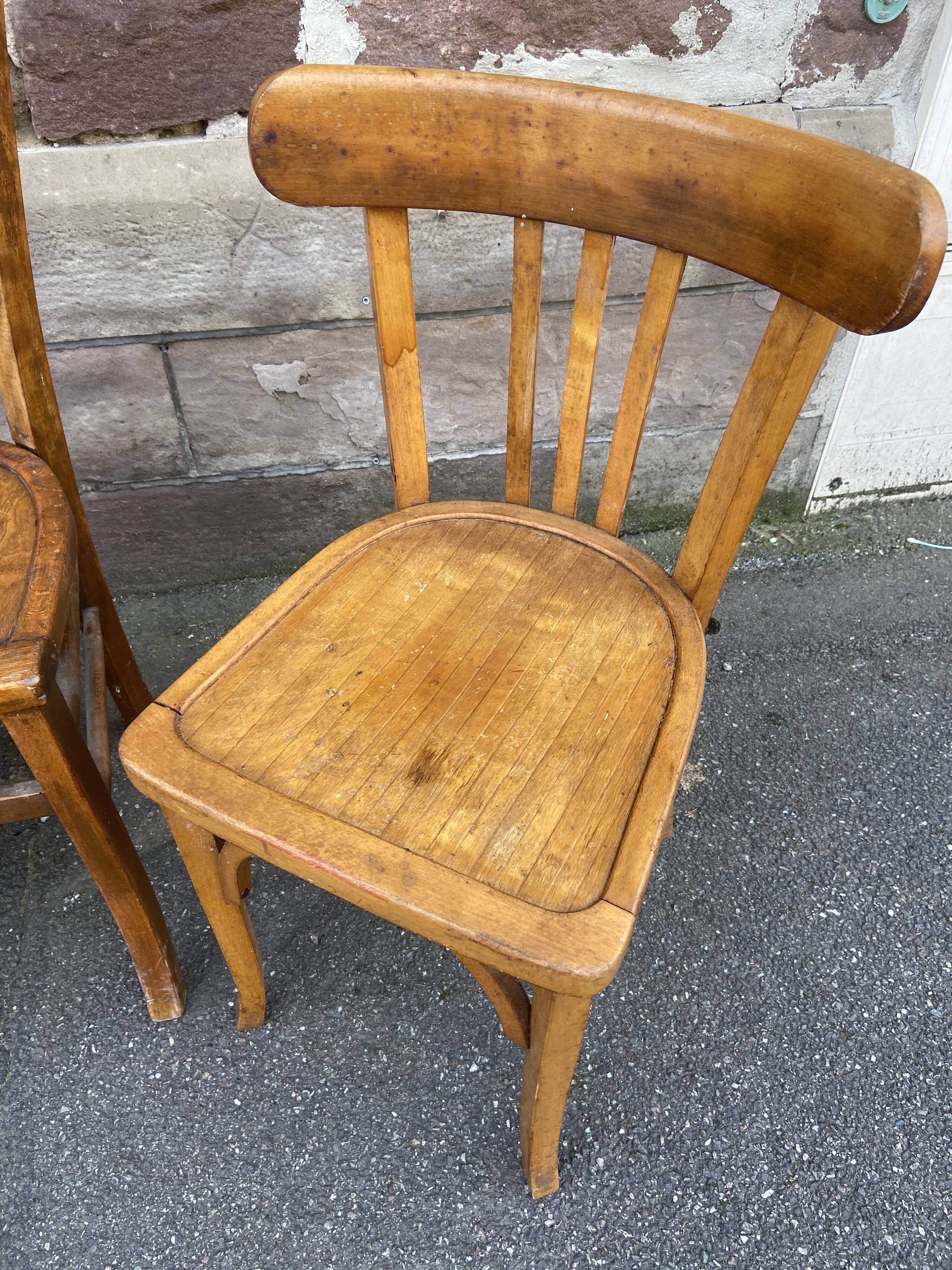 4 mismatched curved wooden bistro chairs