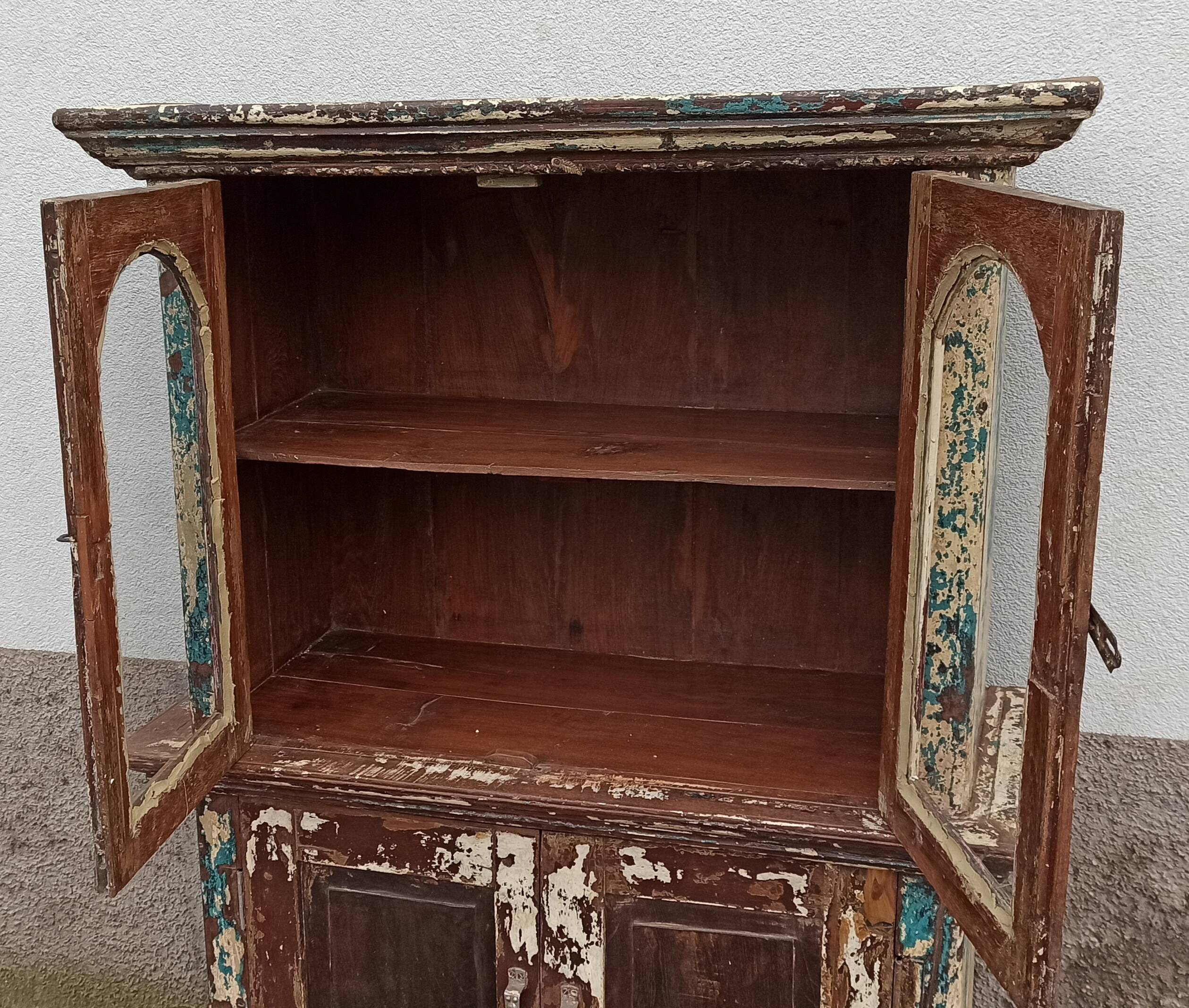 Old patinated wooden glass cabinet