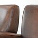 Set of two vintage sheepskin leather design armchairs in a cognac colour