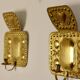 A pair of mid-century Swedish brass wall lights.