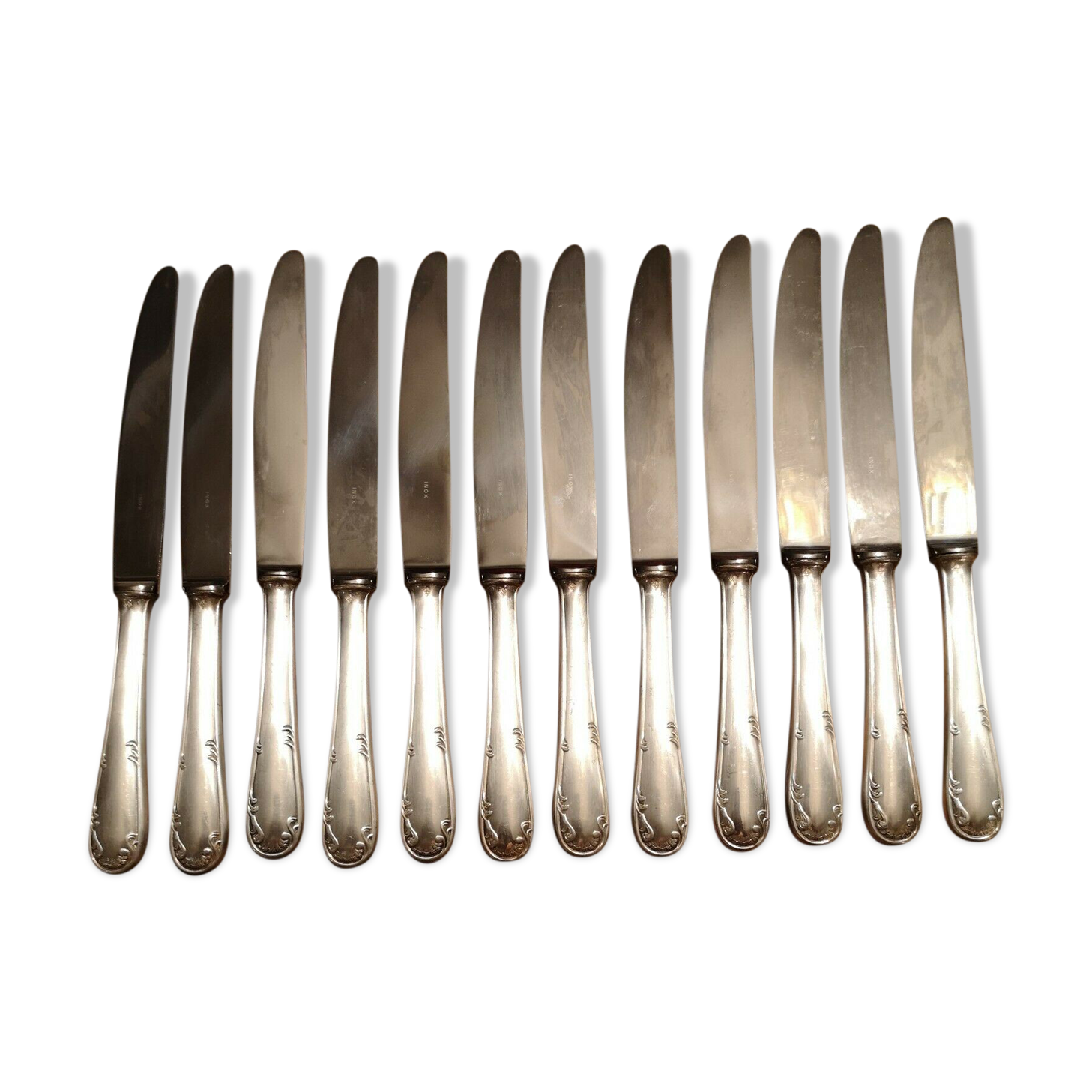 Series of 12 silver metal knives and stainless steel blade Louis XV style floral shell