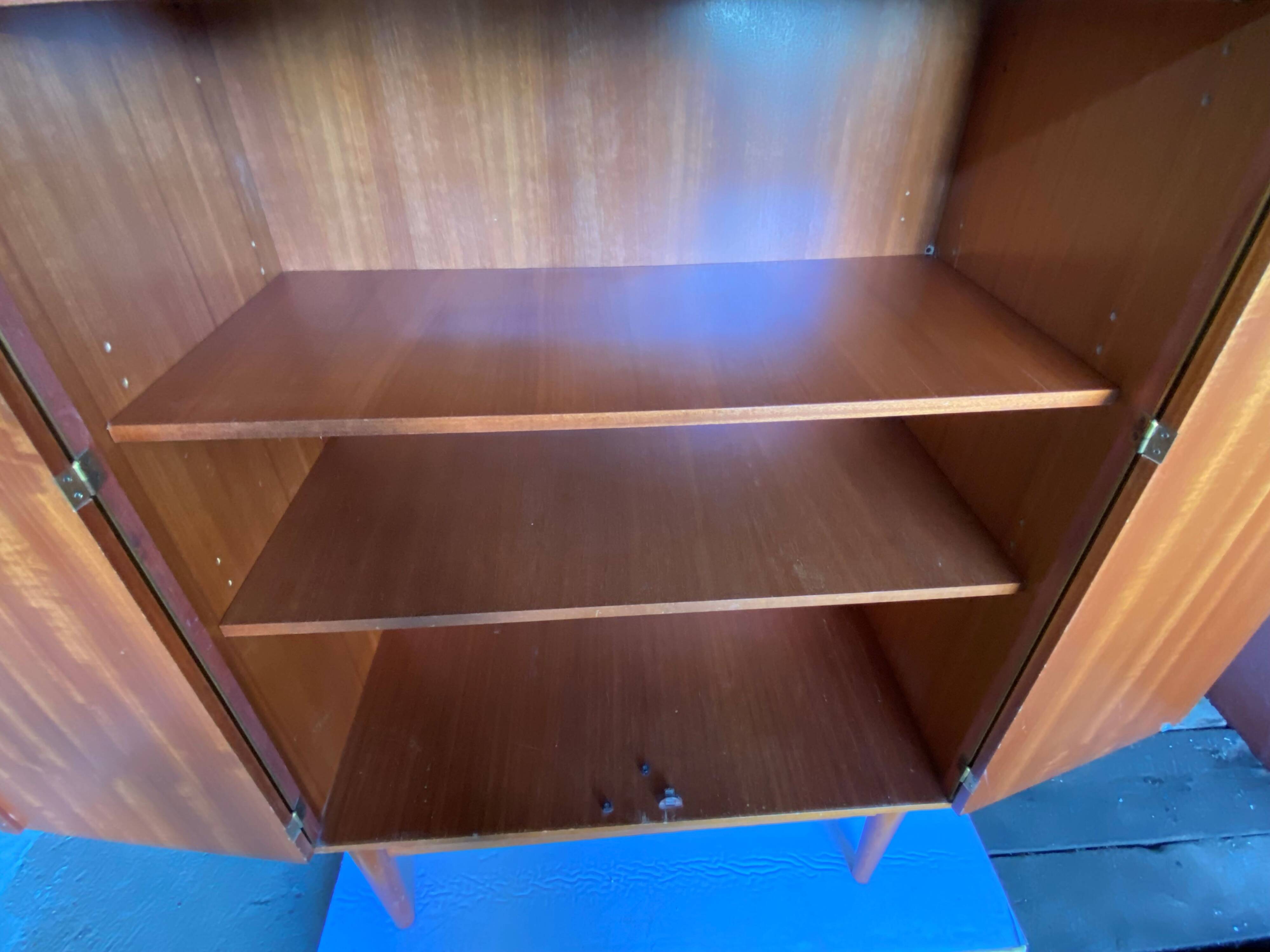 High cabinet with 2 doors in teak and vintage veneer from the 60s