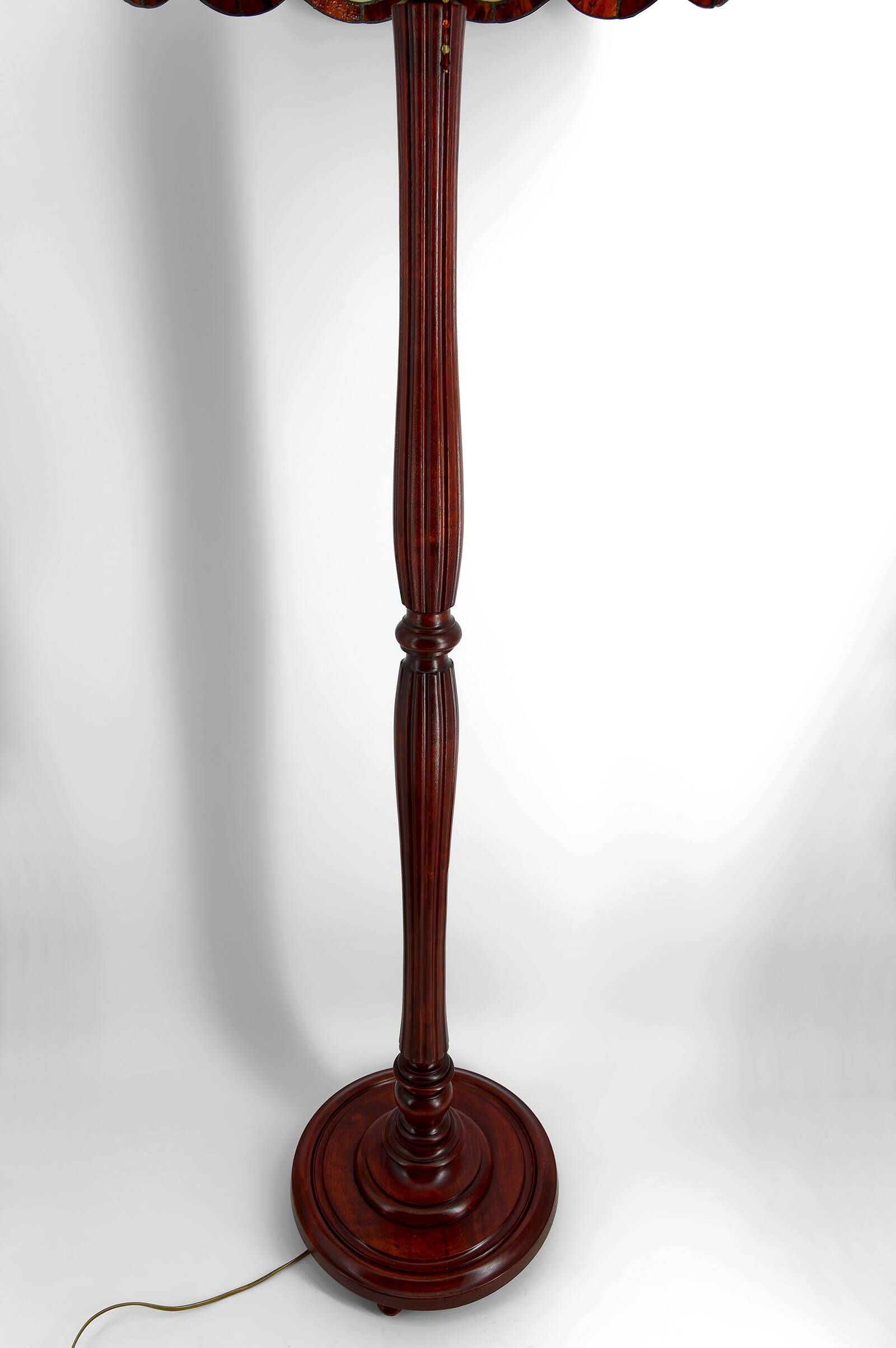 Art Deco floor lamp in carved walnut, stained glass shade, France, c. 1920