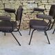Brown faux leather armchairs