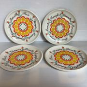 Four vintage floral cheese plates.