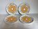 Four vintage floral cheese plates.