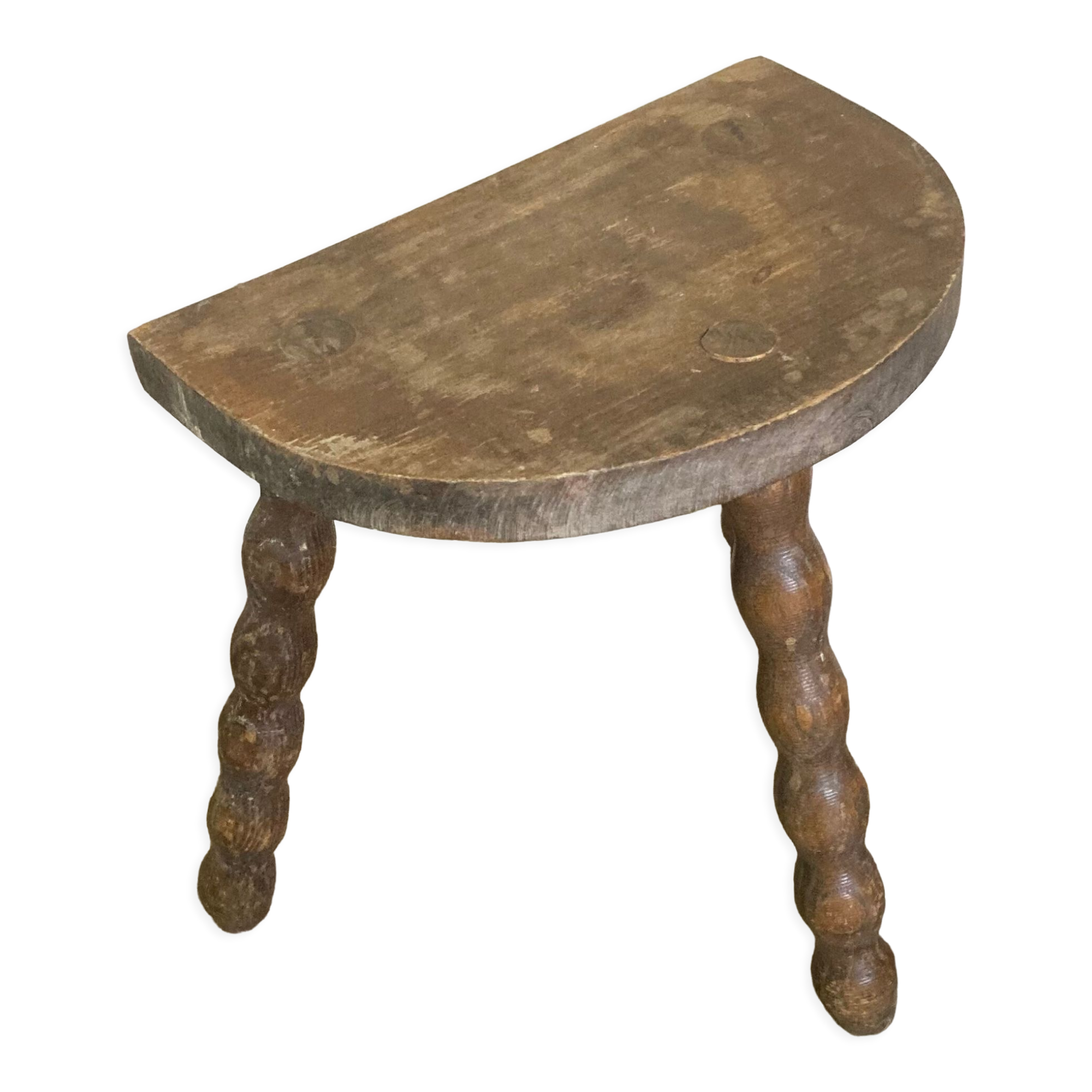 Half-moon tripod stool.