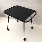 Black table on wheels from the 60s