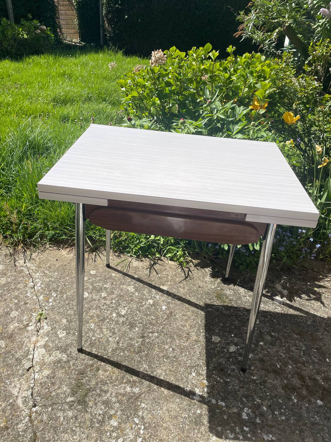 Formica table with a red Mid-century chair.