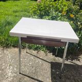 Formica table with a red Mid-century chair.