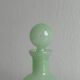 Opaque light green glass vial