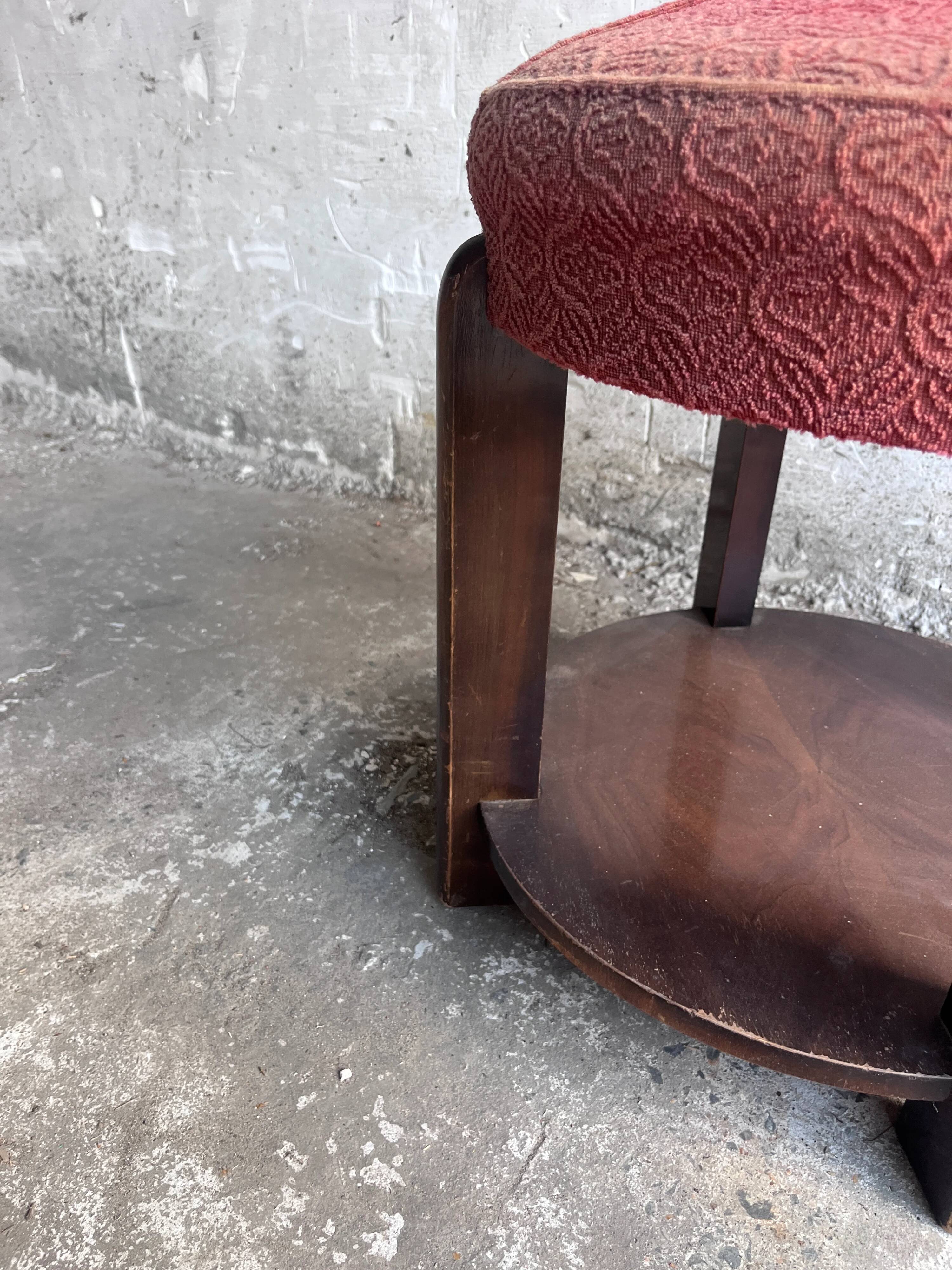 Art Deco stool upholstered with a lower shelf, France, circa 1930.