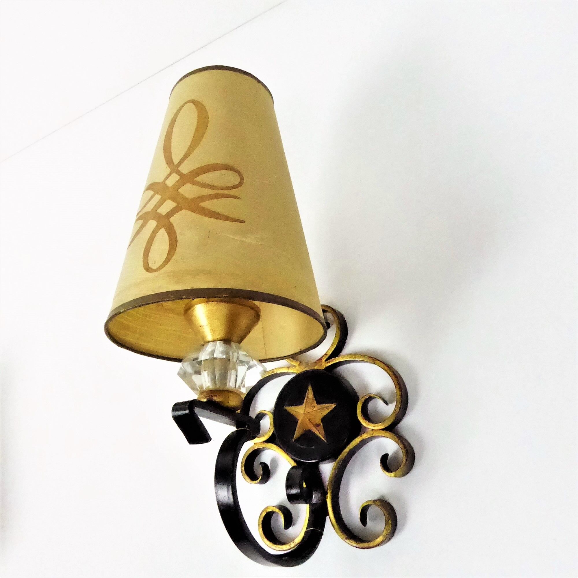 1950 gold star and black metal sconces