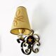 1950 gold star and black metal sconces