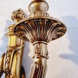 Pair of Louis XV style rocaille two-armed sconces in gilded bronze