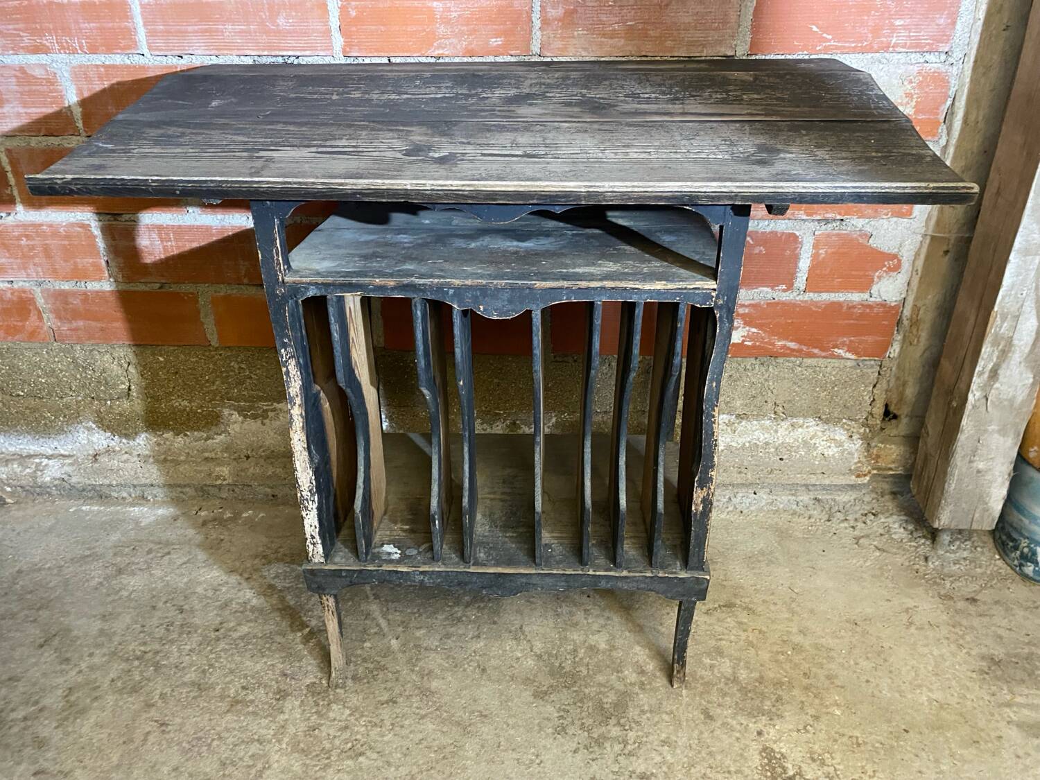 Antique writing desk, blackened wooden filing cabinet.