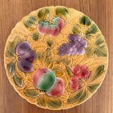 Round earthenware dish decorated with fruit in Sarreguemines slipware