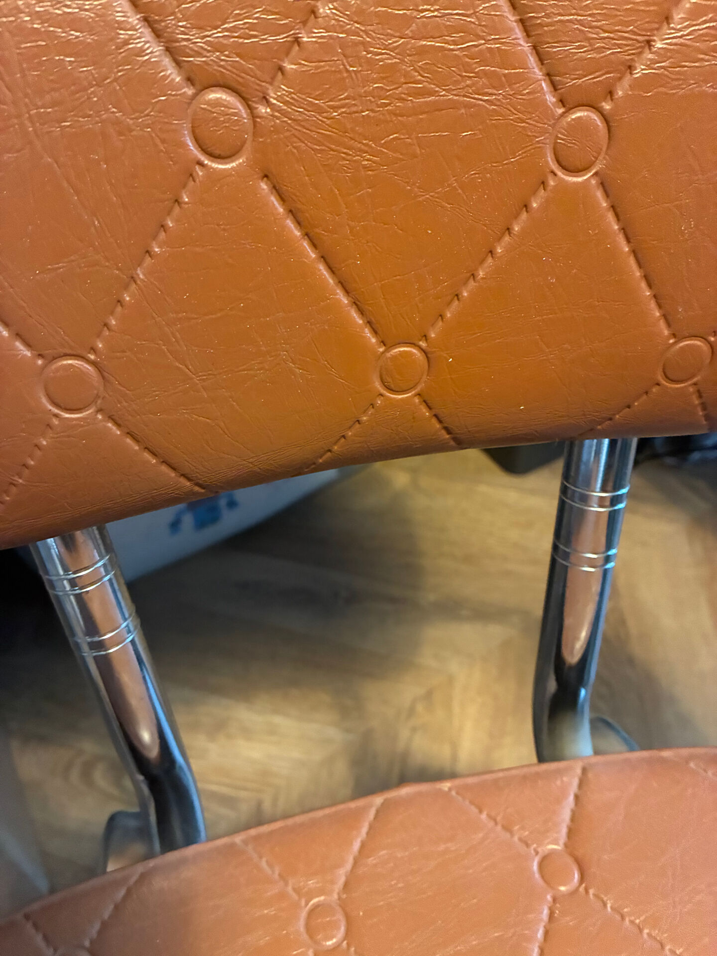 Armchair with armrests from the 70s in Skai and chrome.