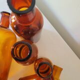 11 bottles of amber glass apothecary