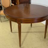 Louis XVl style round table in cherry with extensions