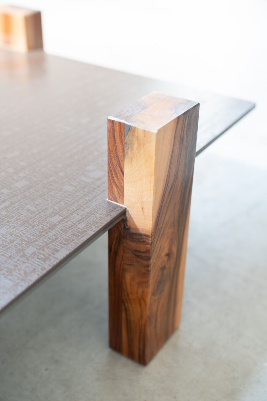 Handcrafted coffee table with ceramic glass top and walnut legs