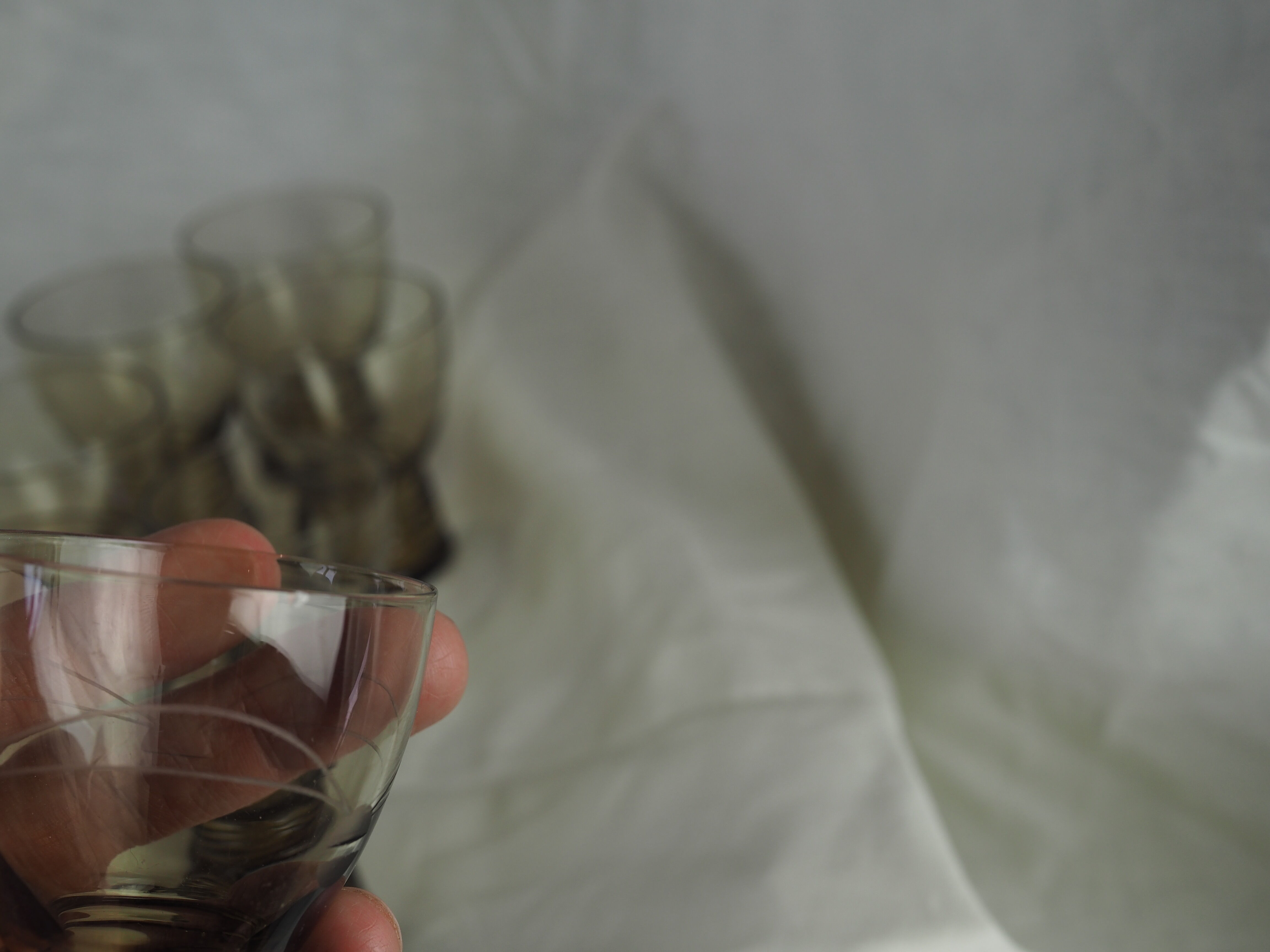 Set of 17 black smoked glasses on geometric engraving stand - 70s