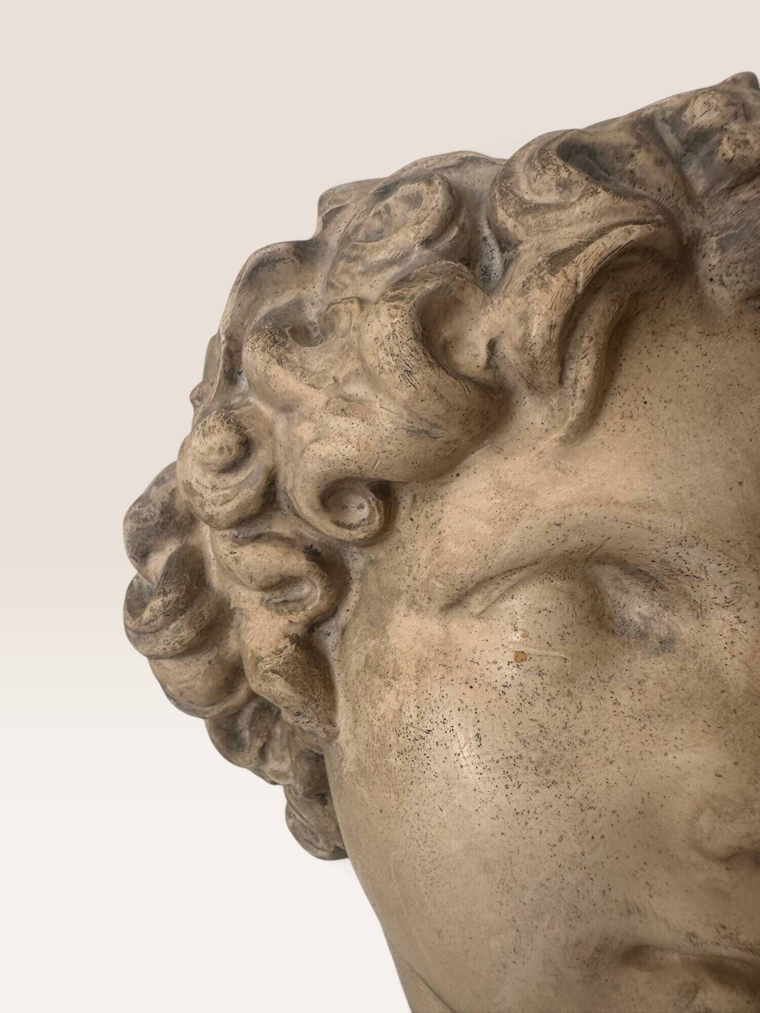 Plaster bust on a wooden base