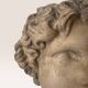 Plaster bust on a wooden base