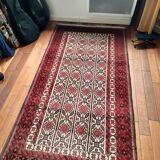 Oriental carpet knotted with red hand