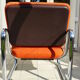 The 1970s orange armchair fabric and chrome metal