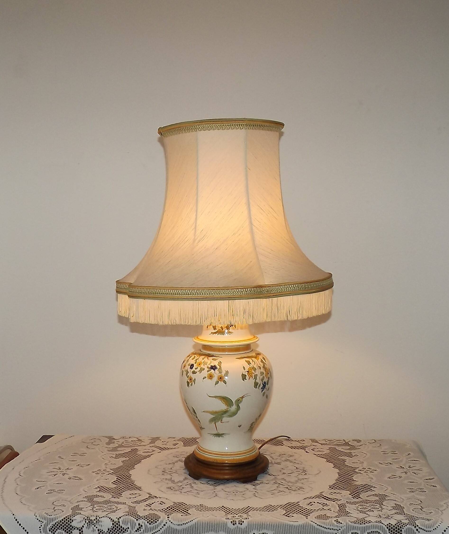 Table lamp with wooden base and fringed shade