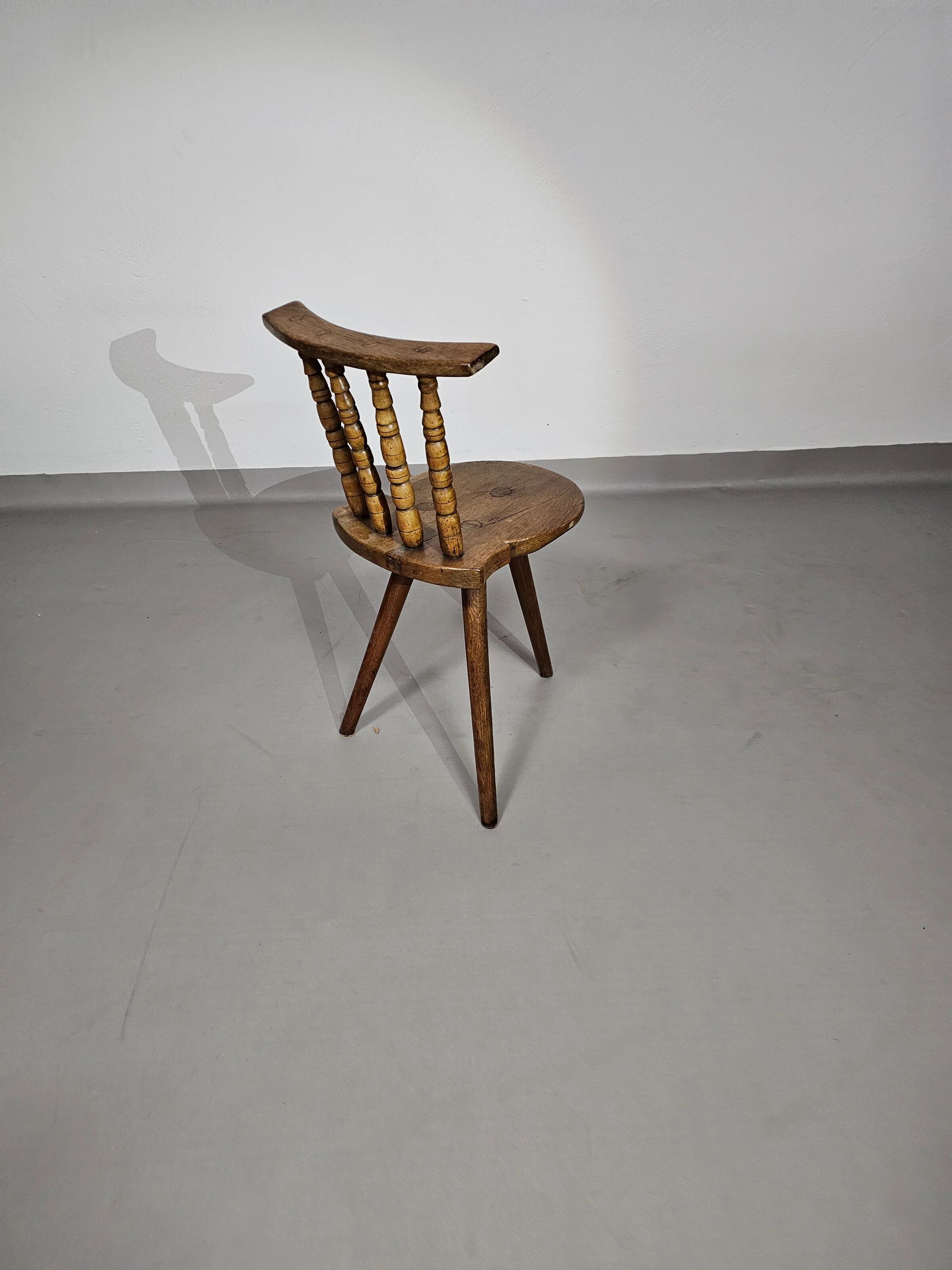 Old farmers tripod chair for decorative use