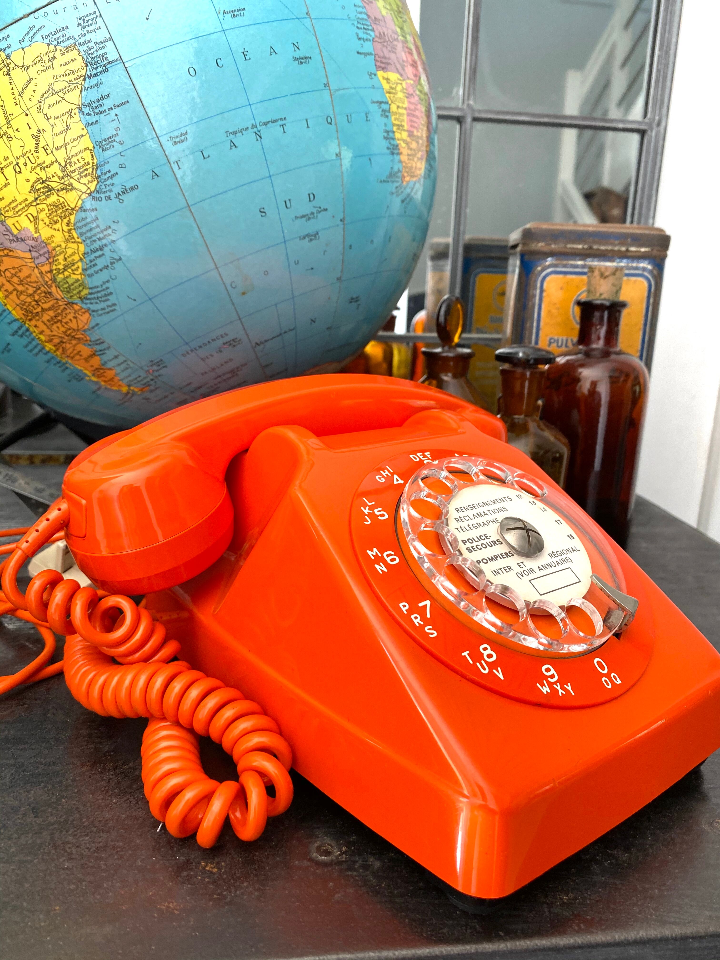 Orange vintage dial phone