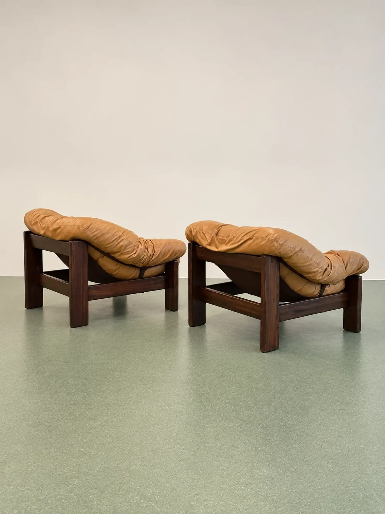 Pair of brutalist leather lounge chairs, 1960s