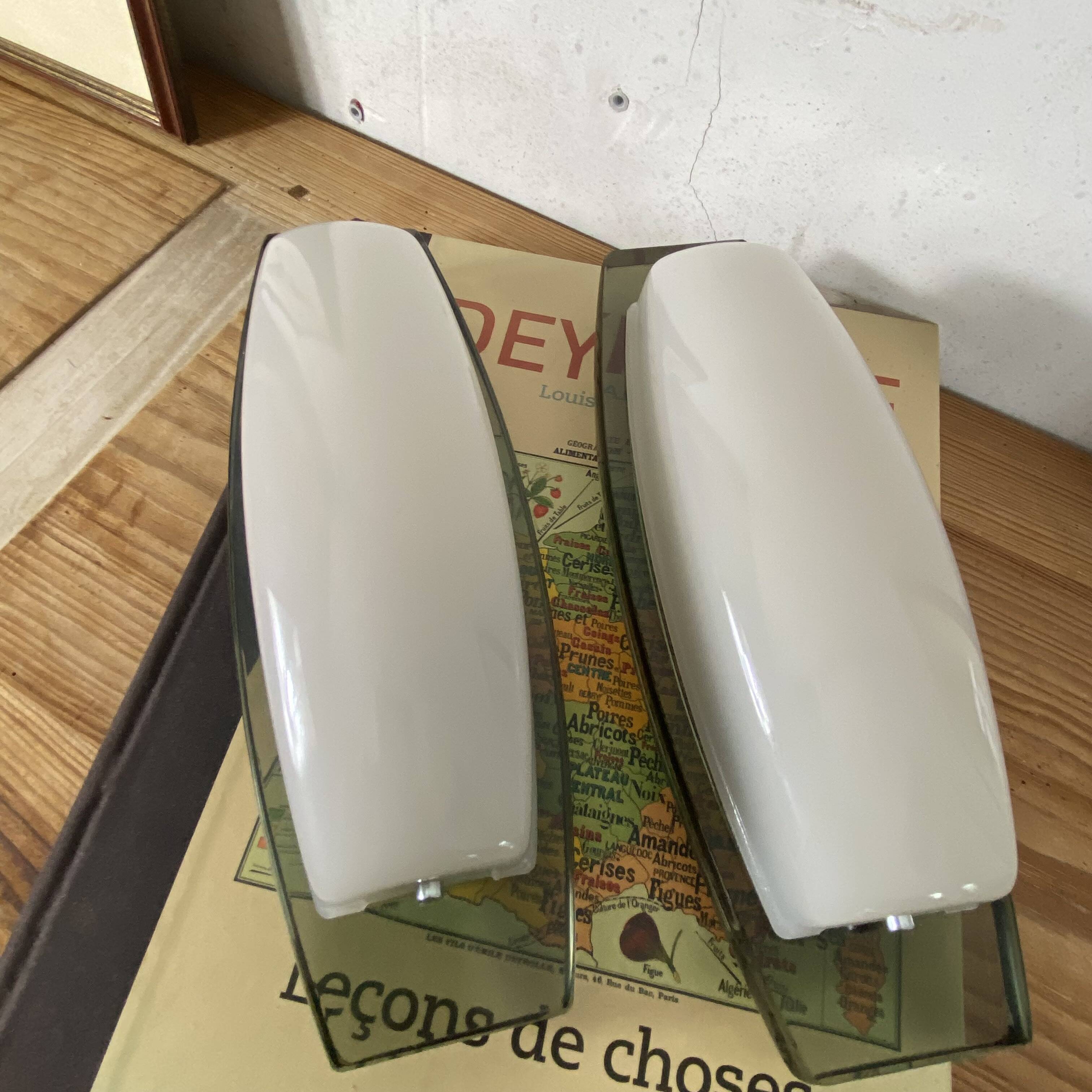 Pair of Veca Fontana wall sconces in smoked and white glass.