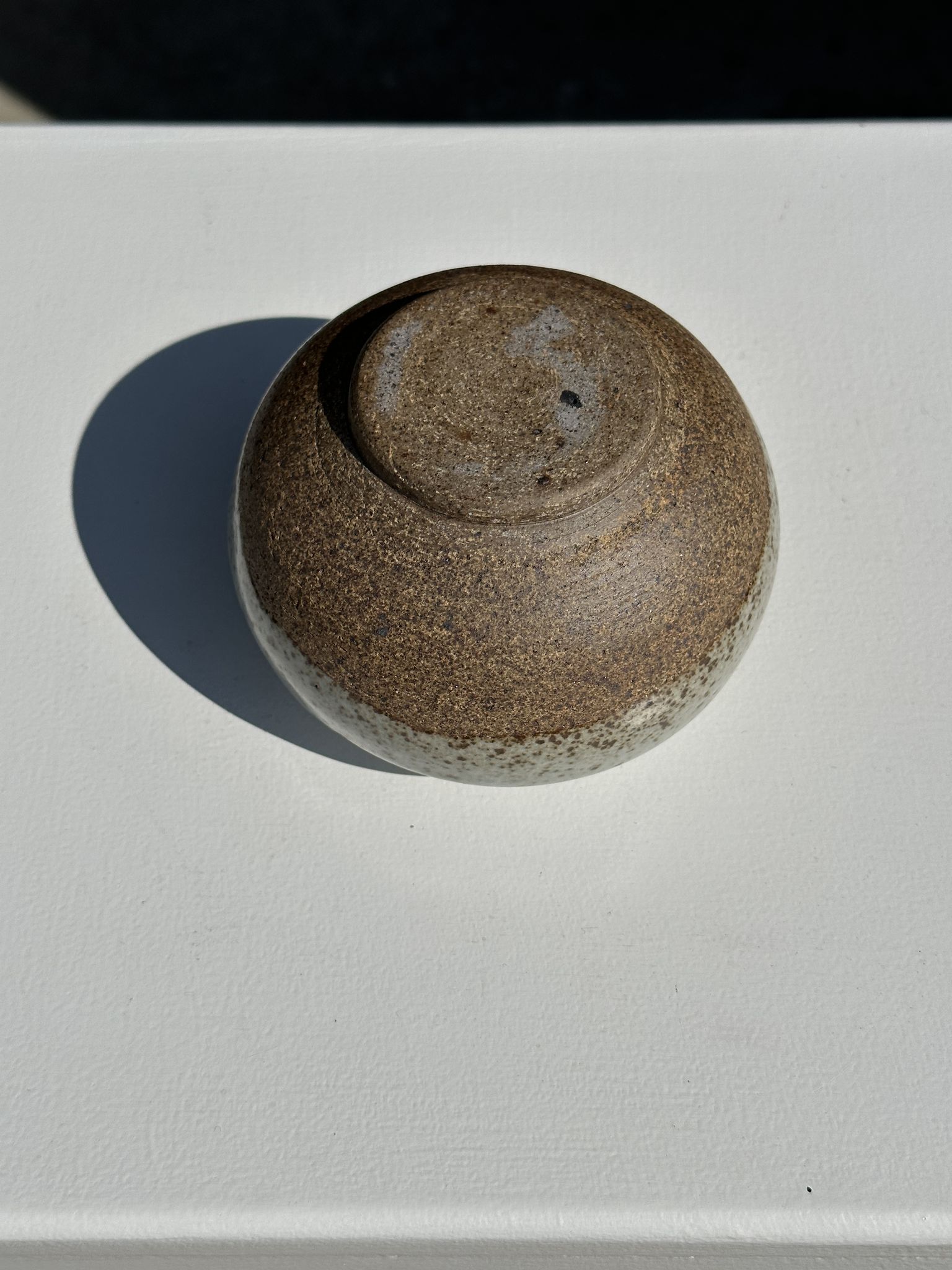Small white ball vase tight neck in glazed speckled ceramic