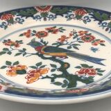 Wall plate in earthenware decorated with painting of flowers and bird 28 cm