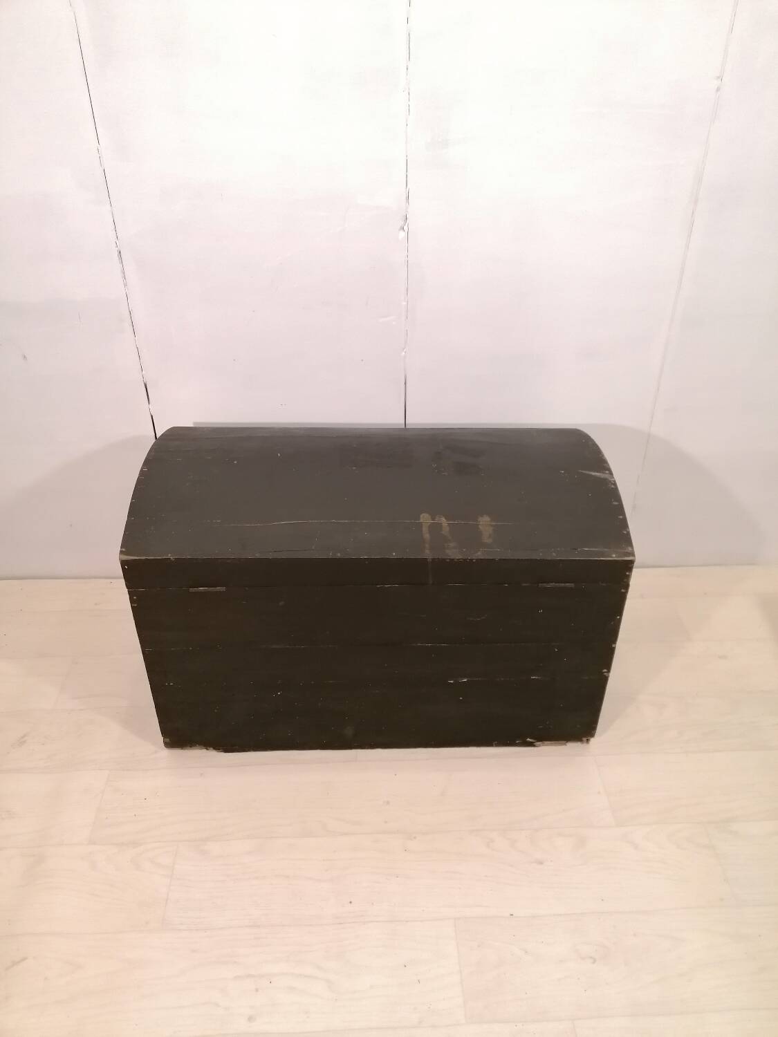 Large travel trunk in blackened wood