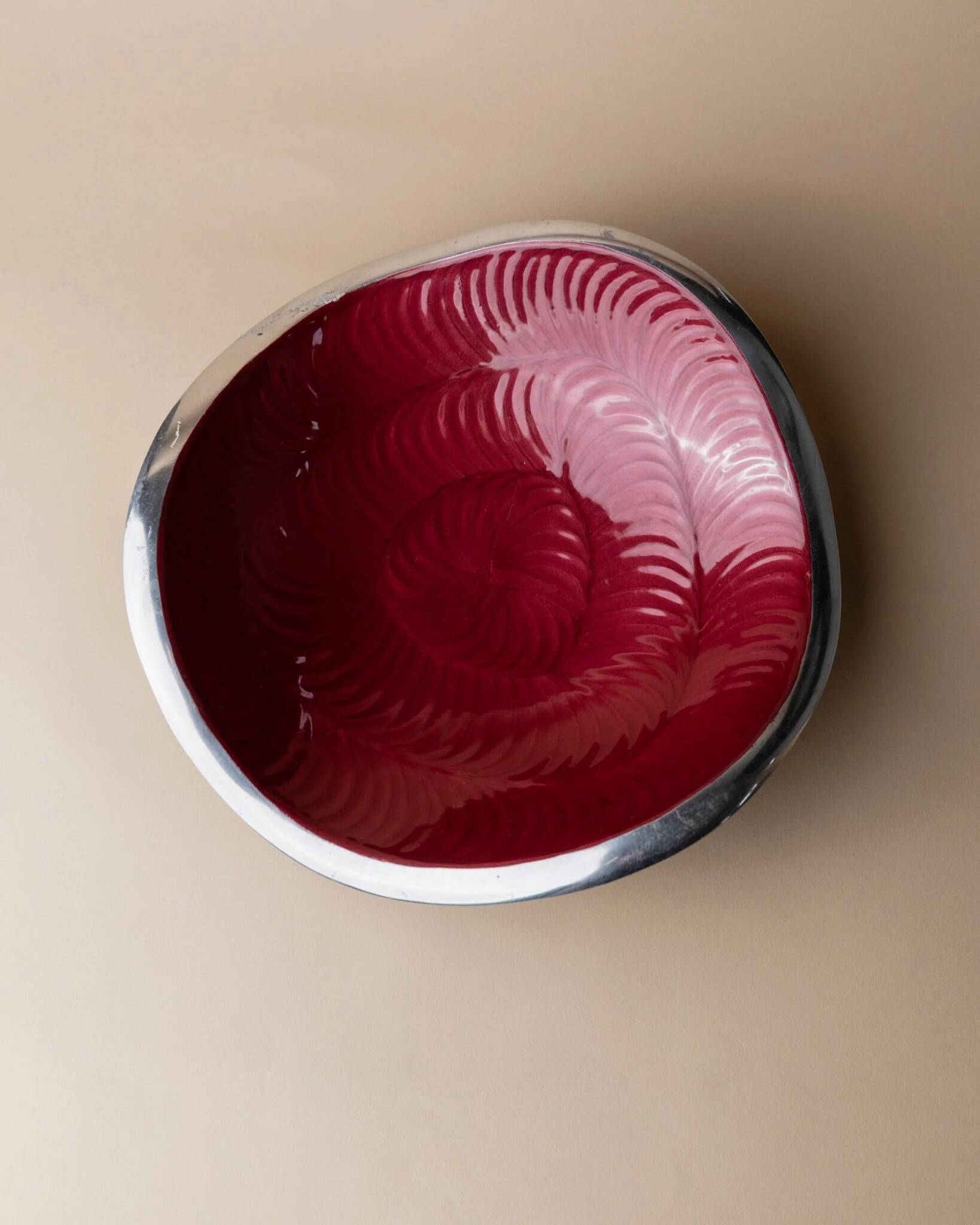 Red enameled steel bowl with textured interior and silver exterior; vintage Italian 1970s design