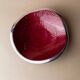 Red enameled steel bowl with textured interior and silver exterior; vintage Italian 1970s design