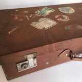 Suitcase of leather with labels of palaces