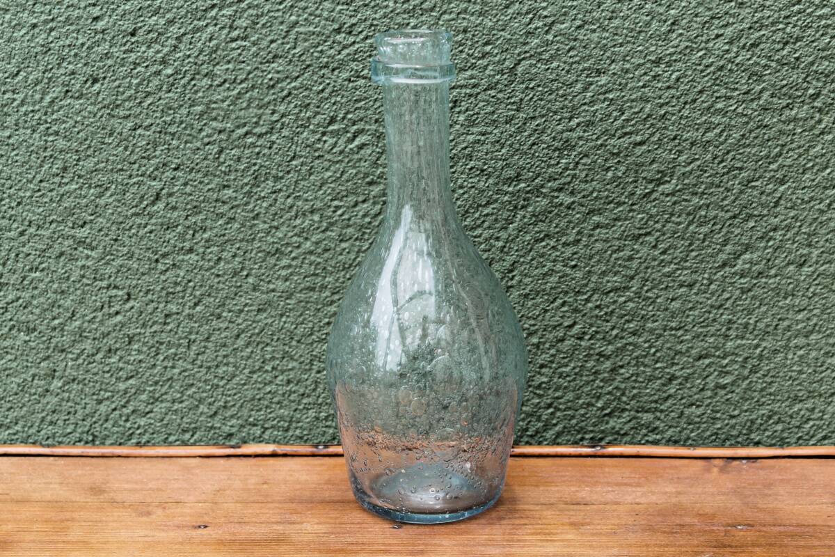 Biot blown glass bottle