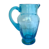 Old pitcher in blue glass