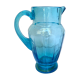 Old pitcher in blue glass