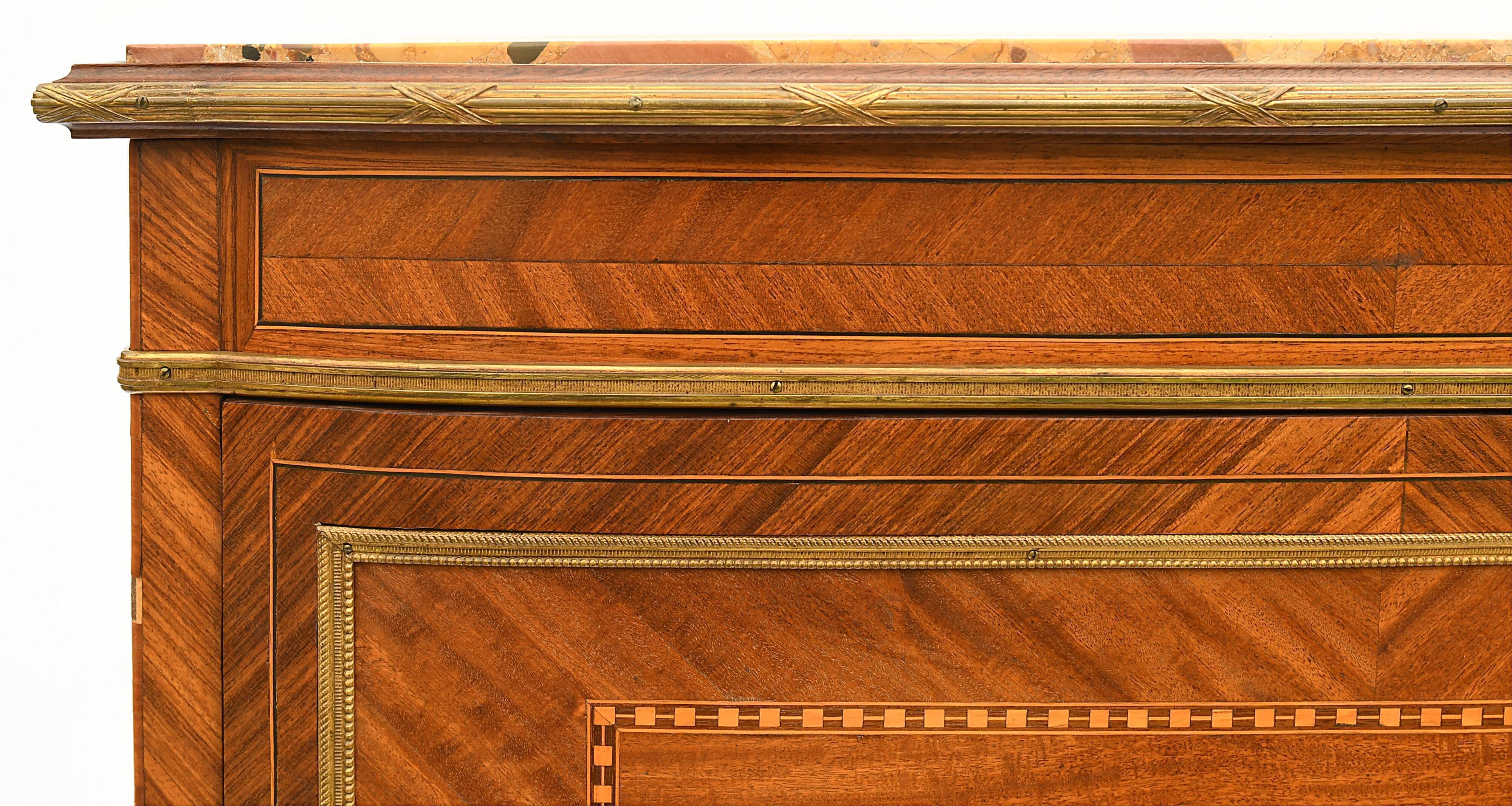 In-between furniture in marquetry decorated with a trophy decoration of musical instruments