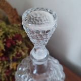 Old carafe in pressed glass grape cluster style